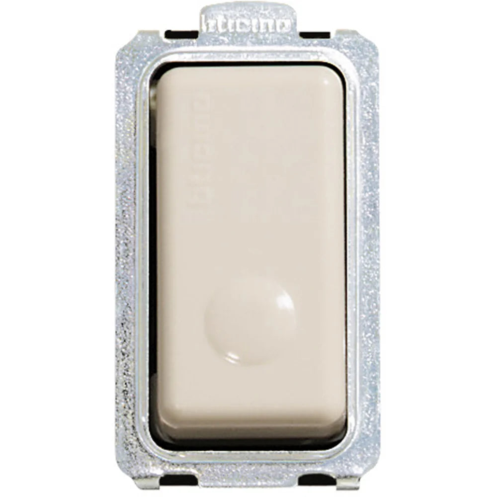 A single rectangular beige push-button switch with a textured silver metal housing, shown against a plain white background.