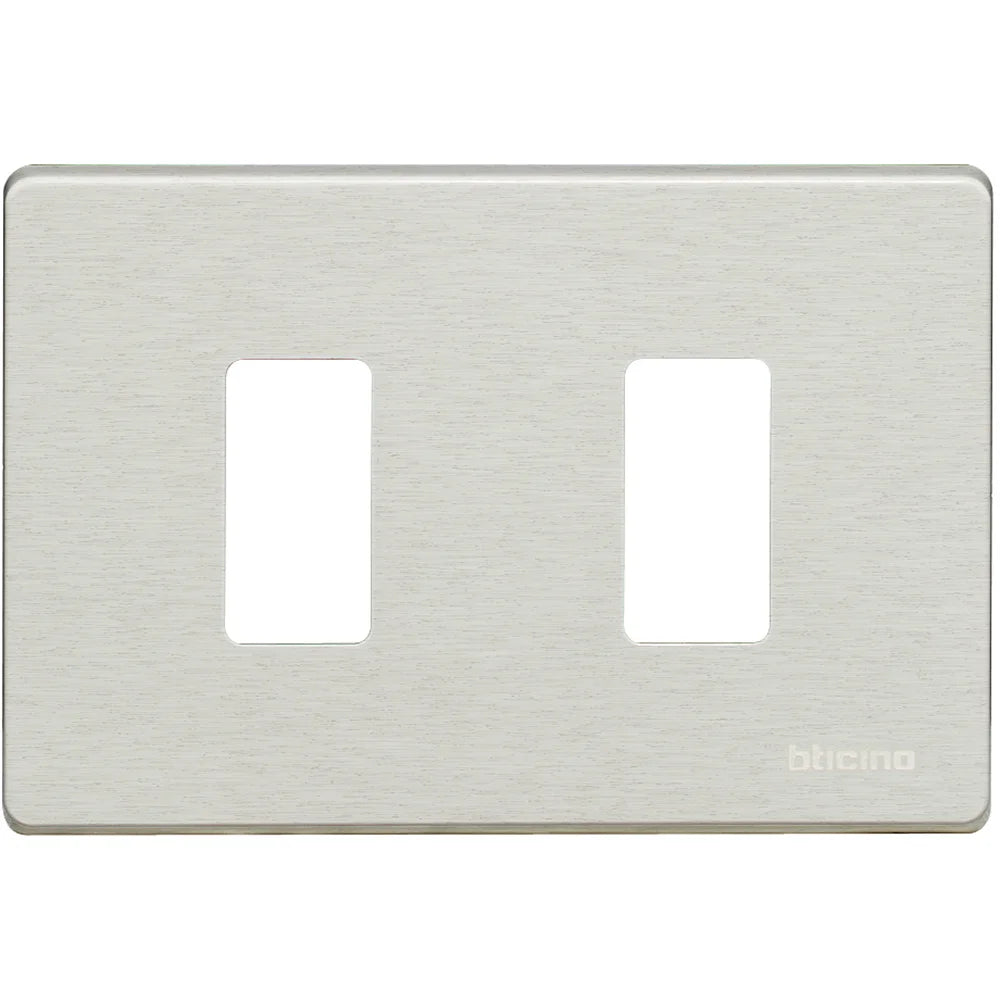 A brushed nickel double-gang switch plate cover by blicino, featuring two rectangular cutouts on a square plate with rounded corners.