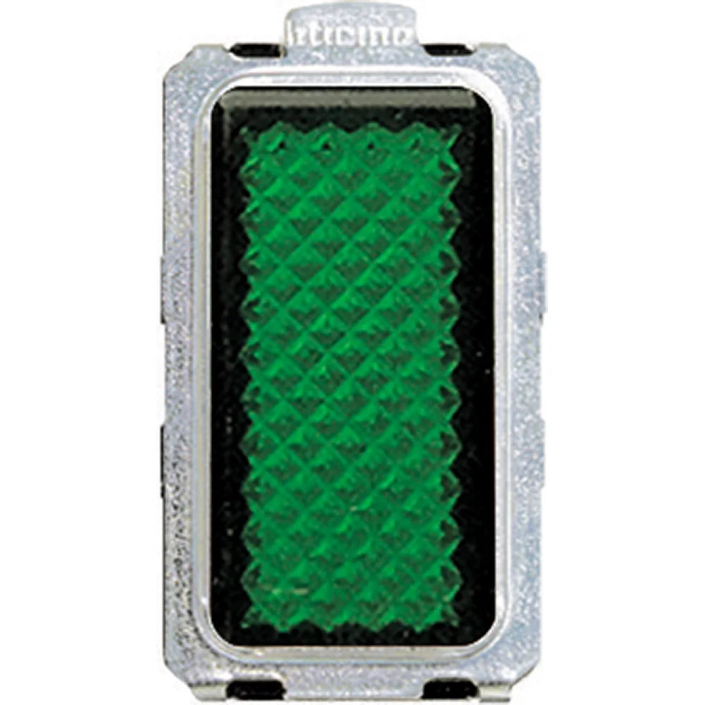 A rectangular green reflective safety reflector with a textured green surface and a silver metal frame, shown on a plain white background.