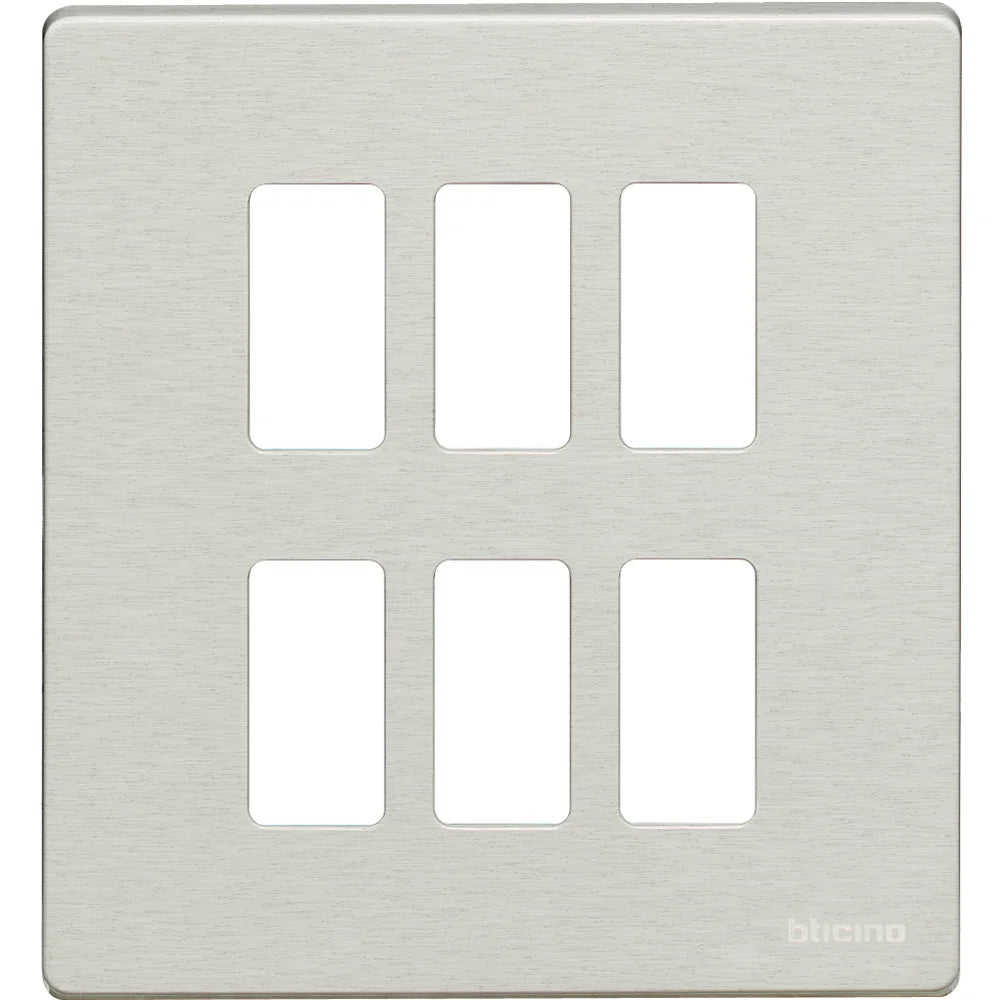 A brushed nickel six-guillote wall plate by bticino, featuring six rectangular cutouts arranged in two rows of three.