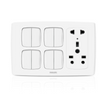 A white Philips 4-way double switch wall plate with an integrated UK three-pin socket on the right side, shown on a clean white background with a subtle reflection.Supplied by Chinoy Electric