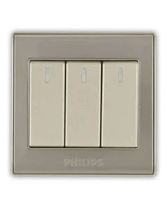 A three-button wall switch plate with a brushed silver frame and cream-colored rocker switches, featuring the PHILIPS brand name at the bottom.Supplied by Chinoy Electric