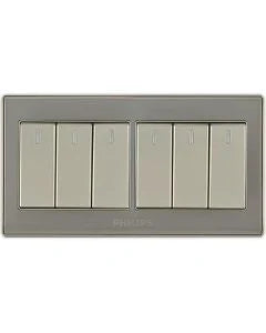 A six-light switch plate set in a brushed silver metal frame with six individual white toggle switches, shown against a plain white background.Supplied by Chinoy Electric