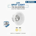 A 7W LED spot light from the K Series, shown as a white recessed downlight with a silver reflective interior. The image includes text specifications ('7W (HL3CBNK)', 'CUT OUT 75MM (3 INCHES)'), color temperature options (3000K and 4000K), a '12 MONTHS WARRANTY' badge, and feature highlights.