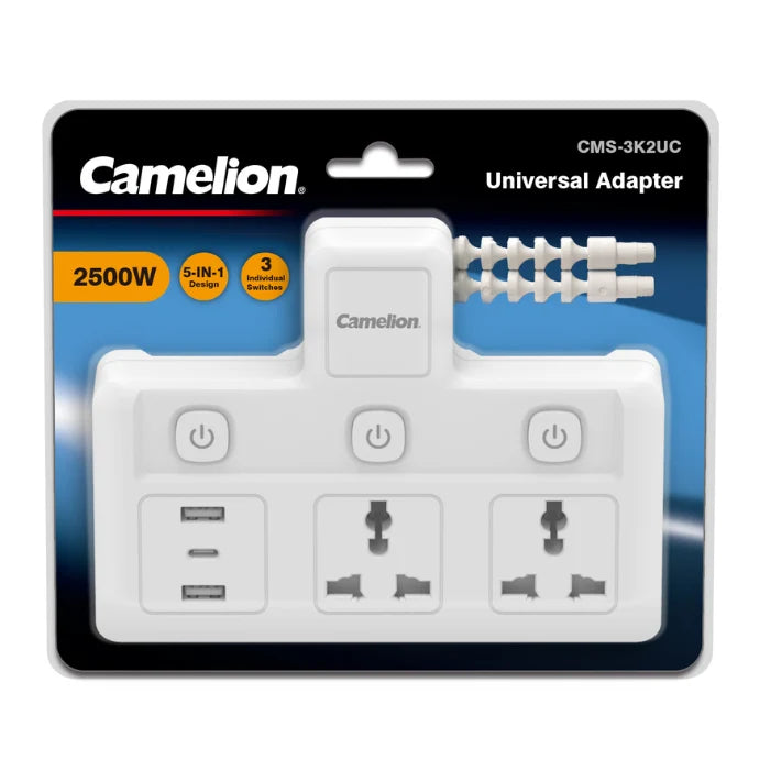 Camelion 2500W universal adapter in retail blister packaging, featuring a white multi-outlet power strip with USB-A and USB-C ports, three UK three-pin wall sockets, and a built-in power cord extender.